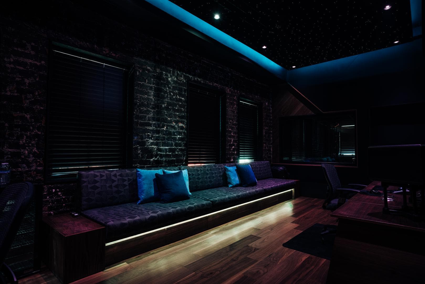 Couch under the fiber optic starfield ceiling in the Phantom room at night